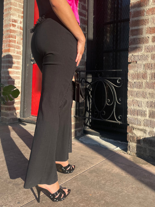 girl wearing black pants and black and red corset