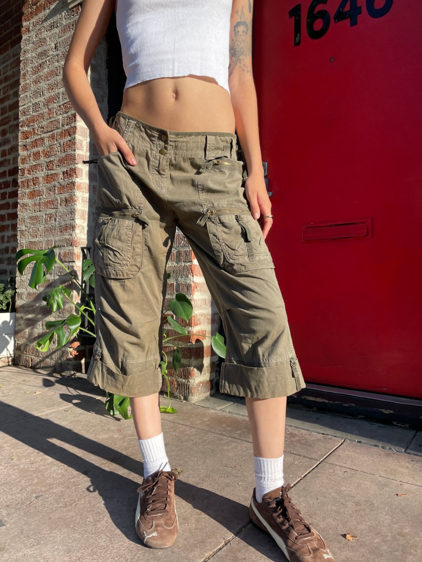 girl in olive cargo shorts
