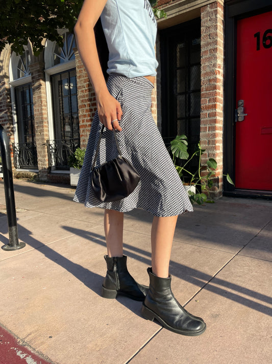 girl in graphic t-shirt and gingham skirt