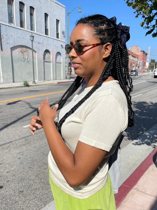 girl wearing beige crew neck blouse