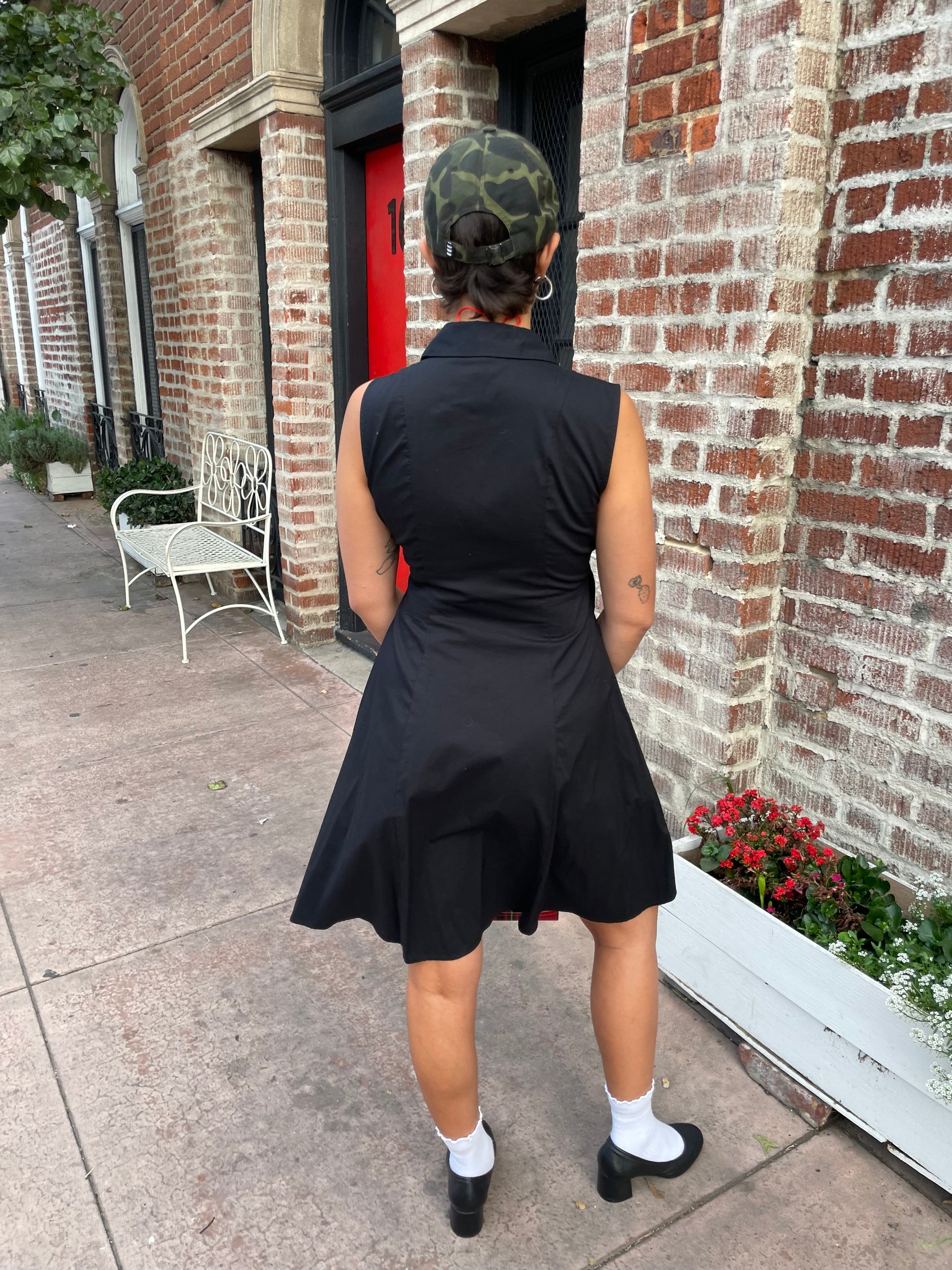 girl in black sleeveless dress