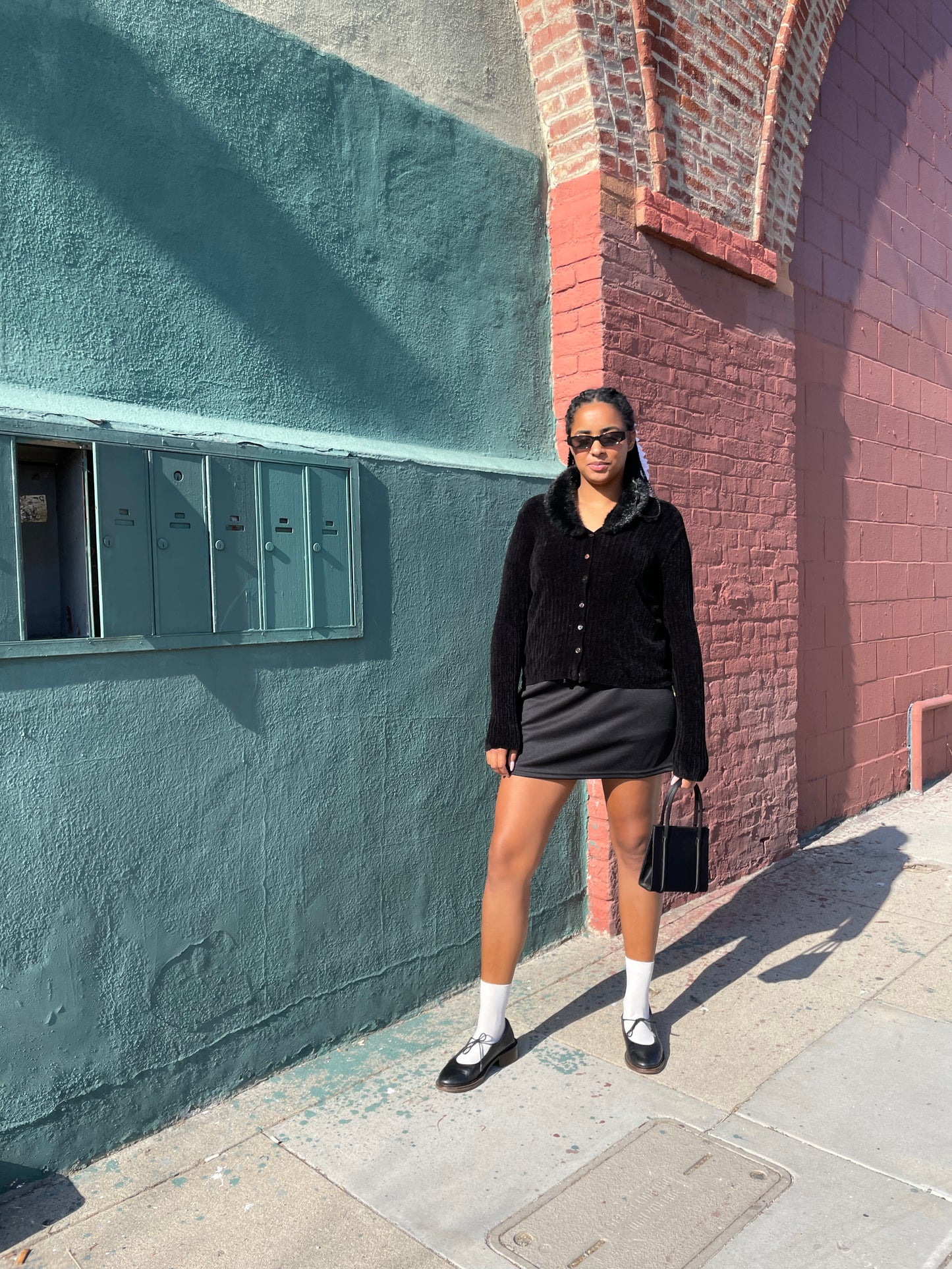 Girl wearing 90s Black Faux-Fur Cardigan