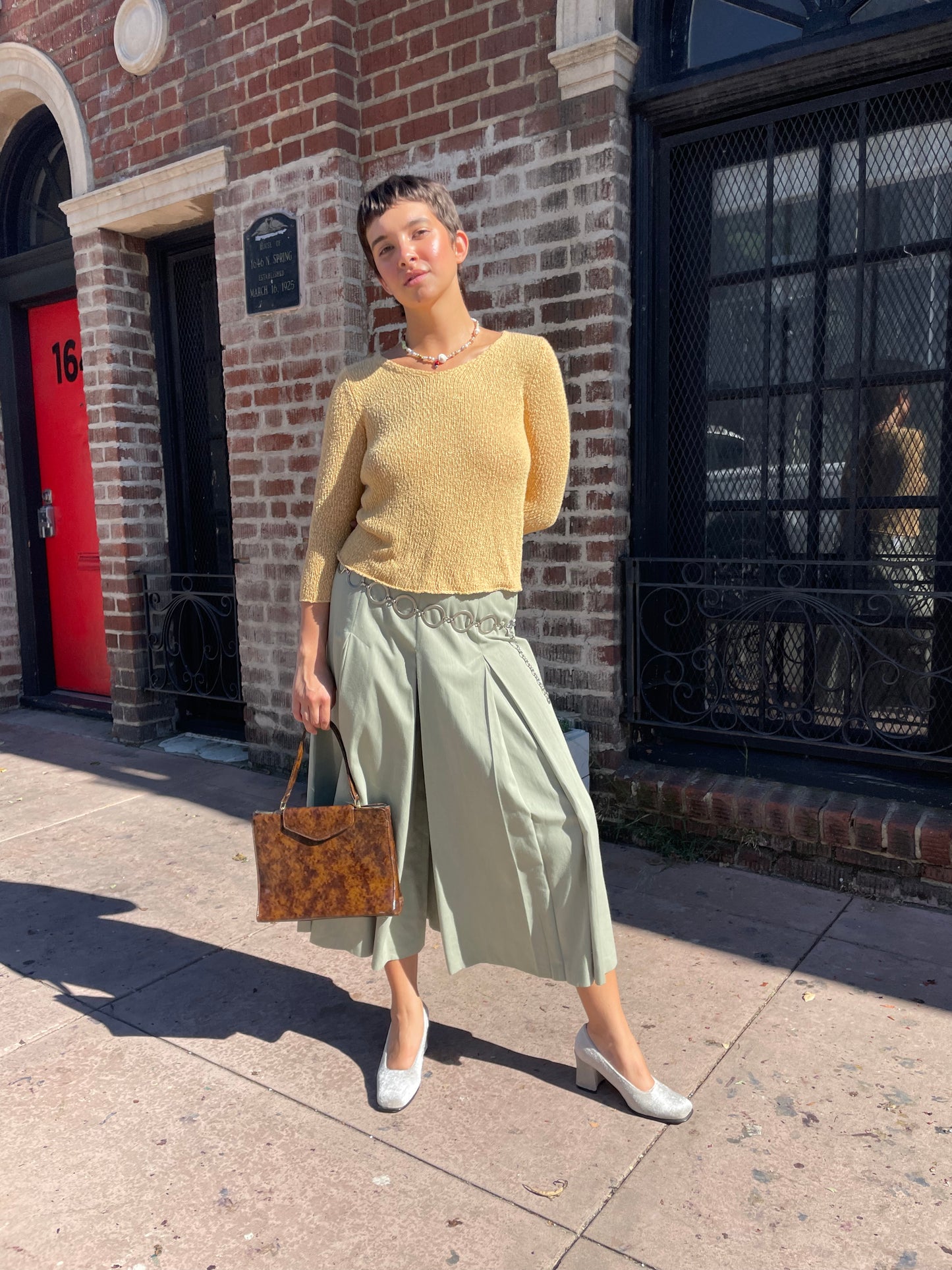 girl wearing yellow top and olive pants