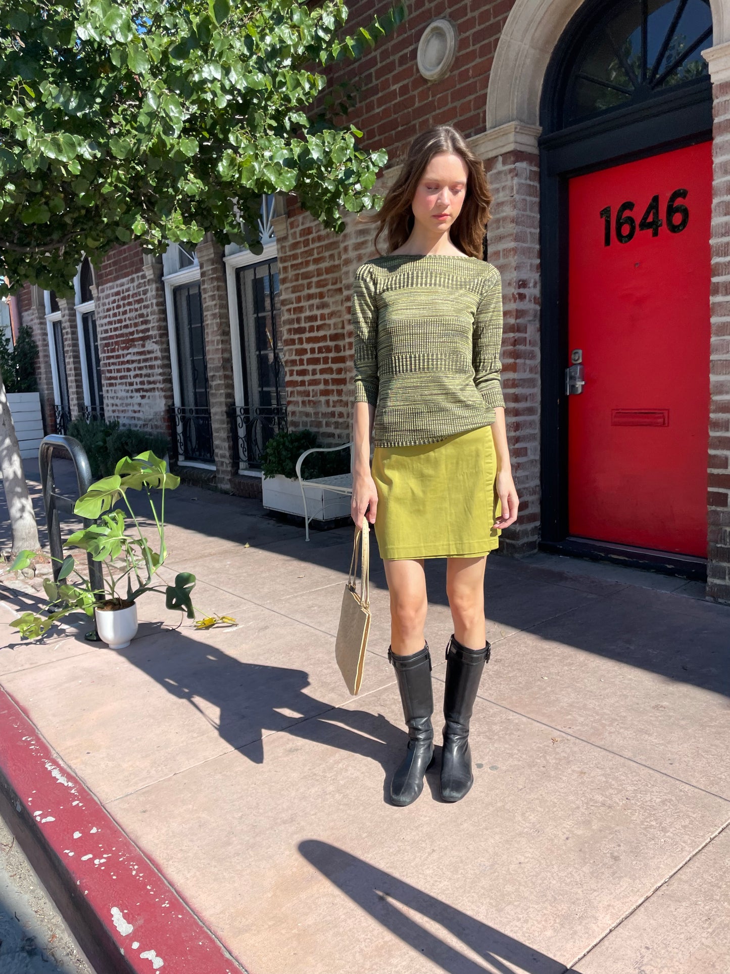 girl in green long sleeve and green skirt
