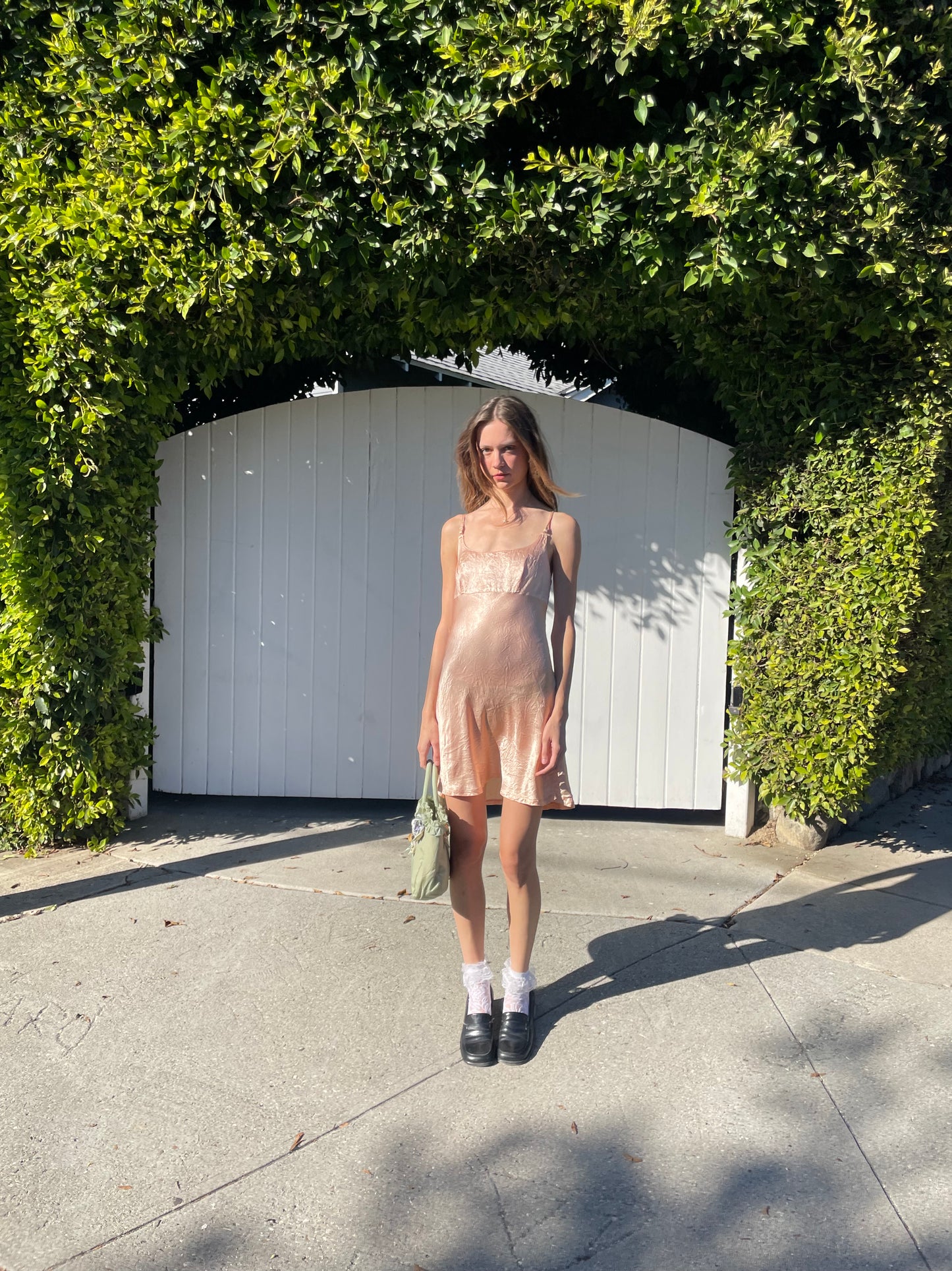 girl in silky pink dress