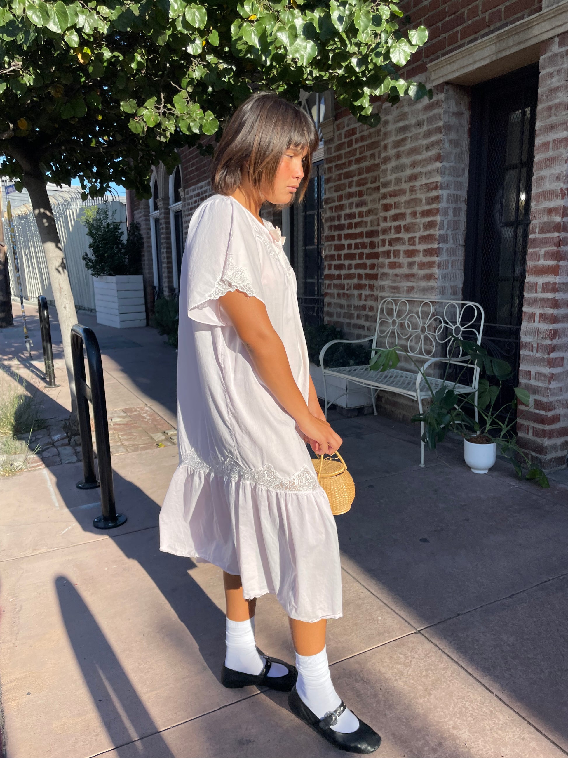 girl wearing a Powder Pink Rose Slip Dress
