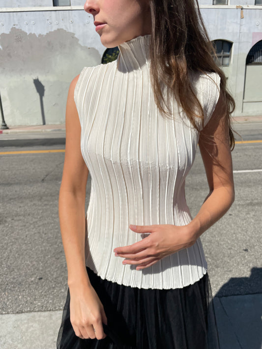 girl in white high neck top