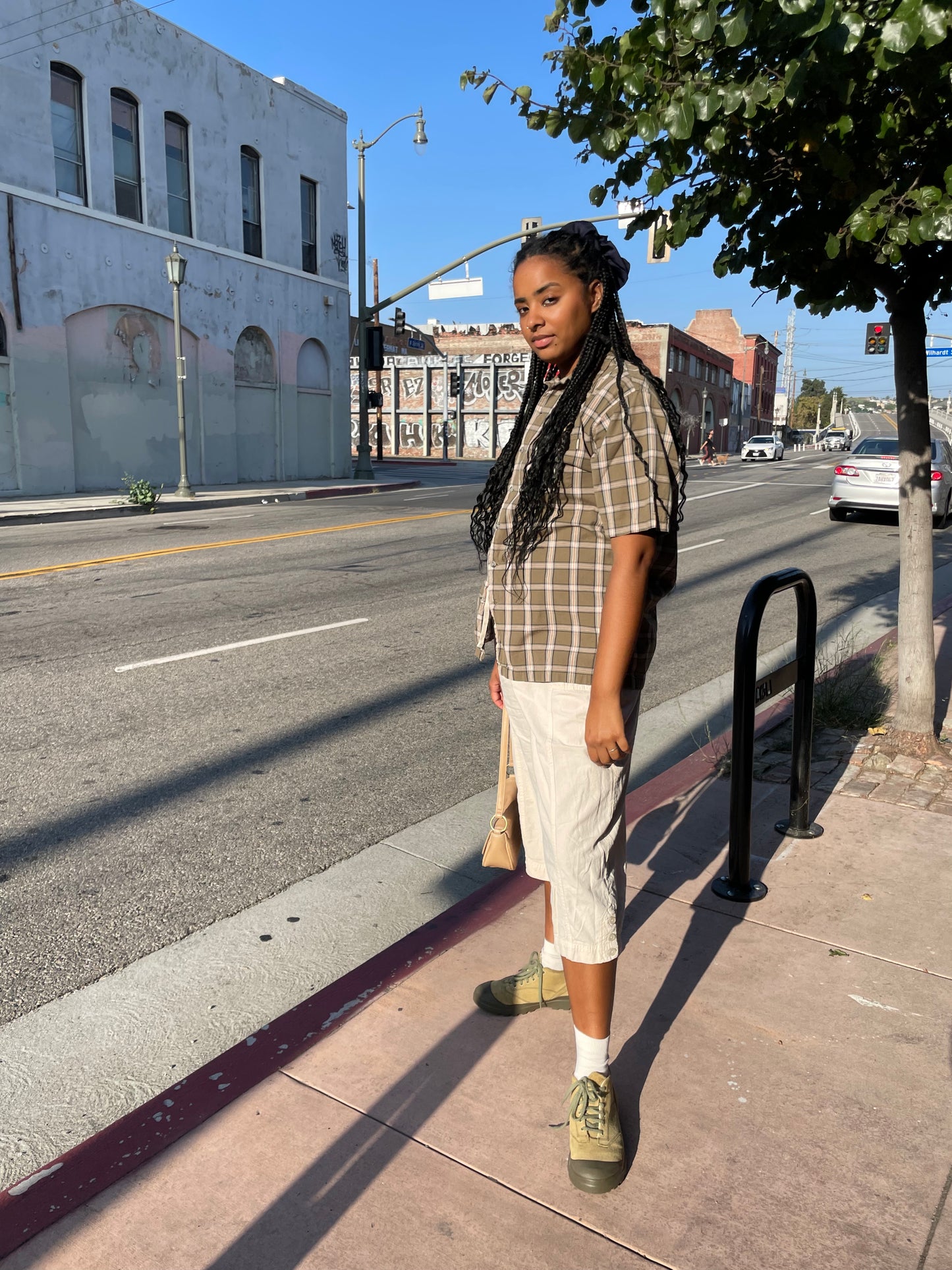 girl in plaid green button up and khaki pants