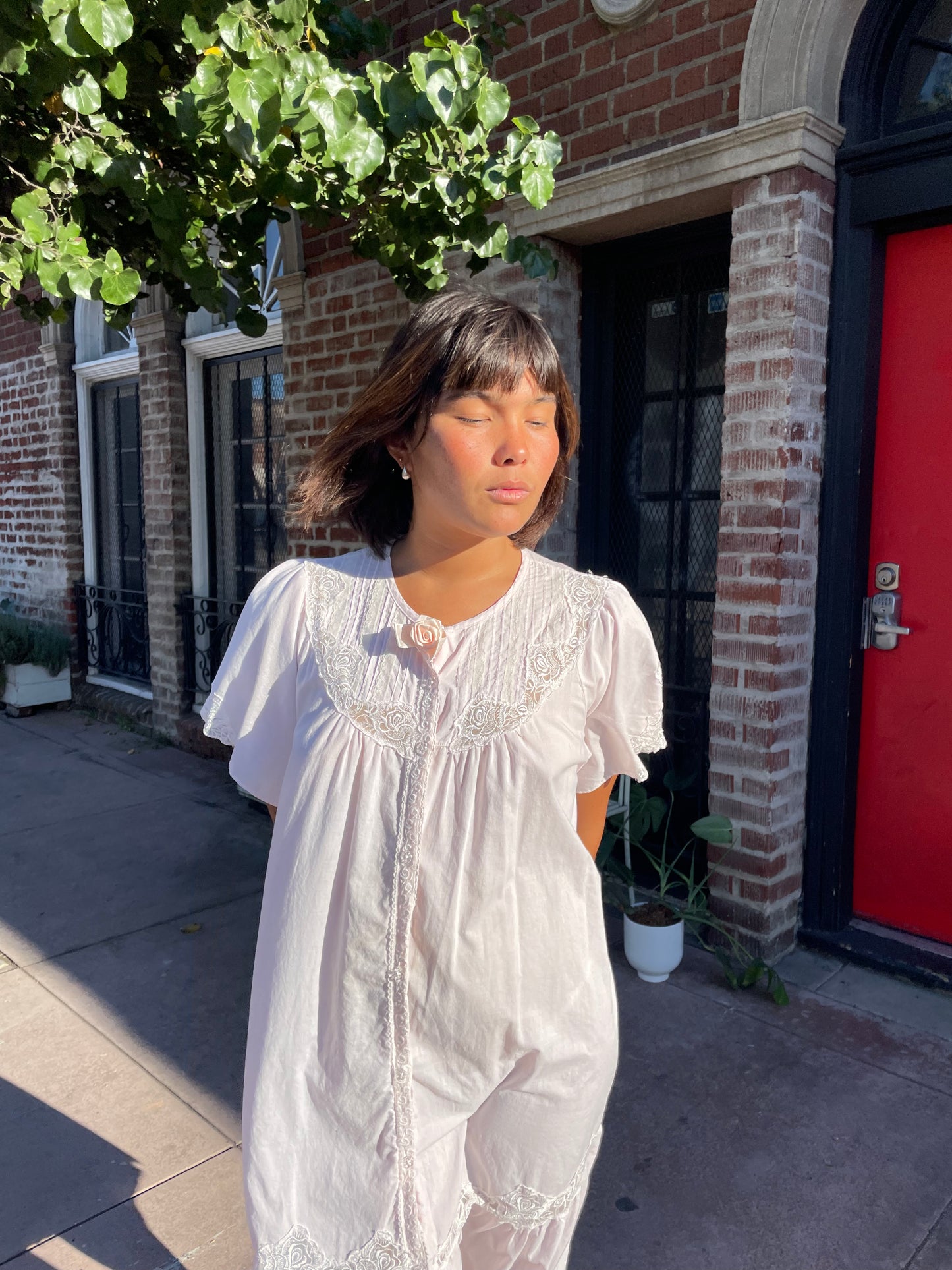 girl wearing a Powder Pink Rose Slip Dress