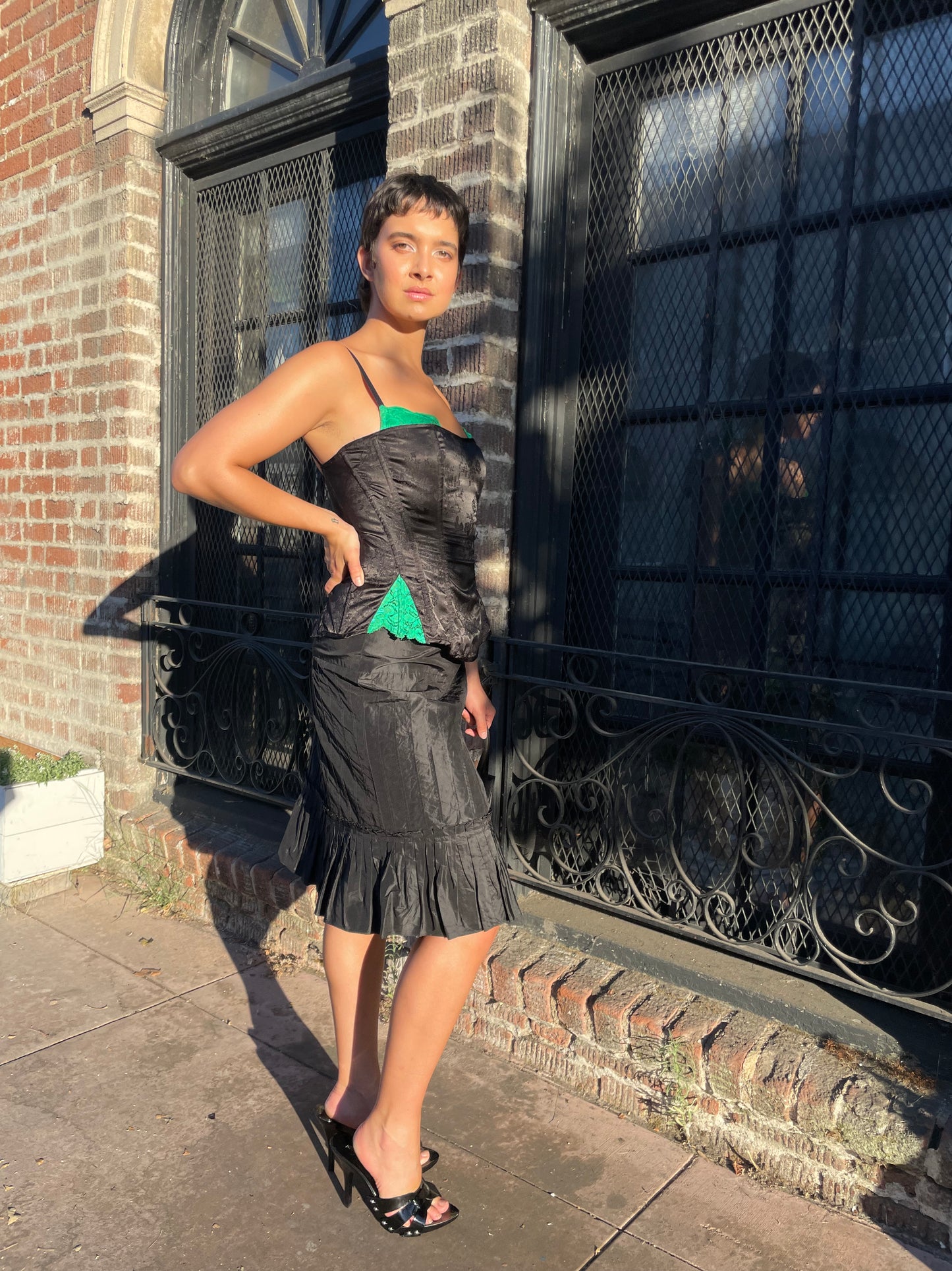 girl in black and green corset