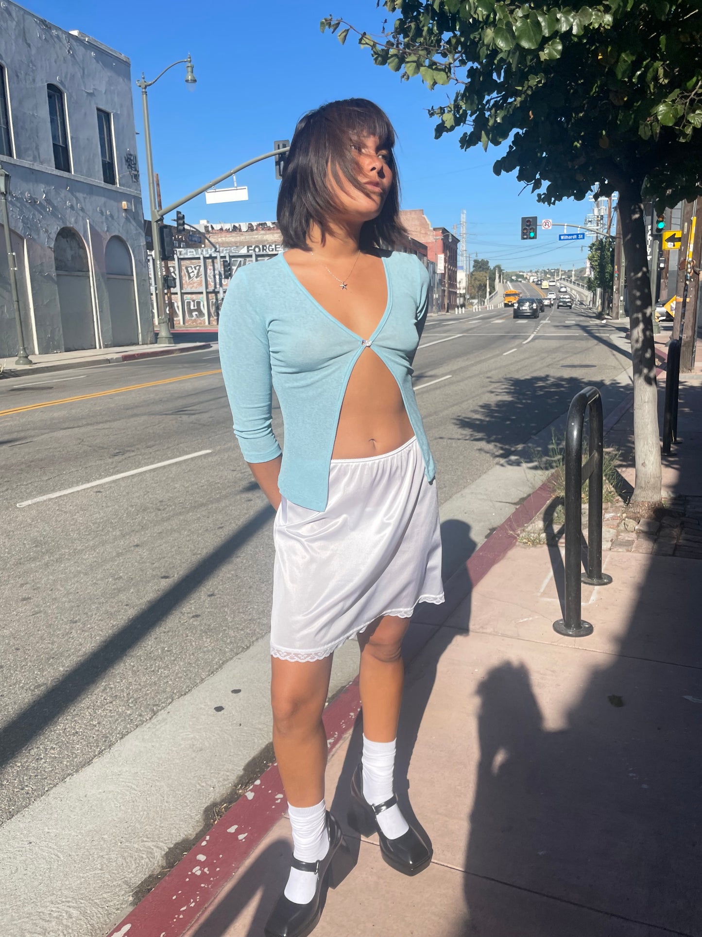 girl in blue button cardigan