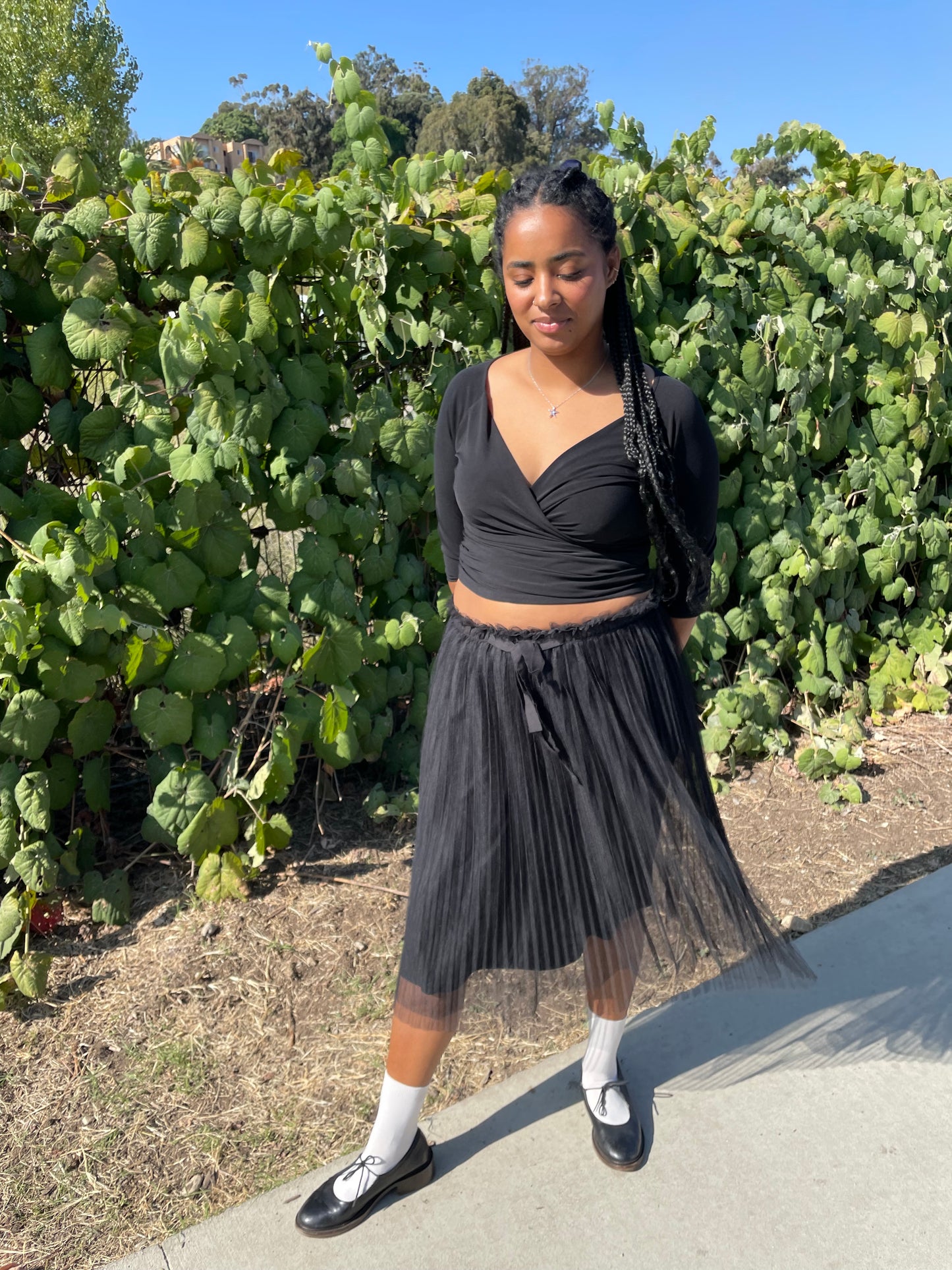 girl wearing black wrap top