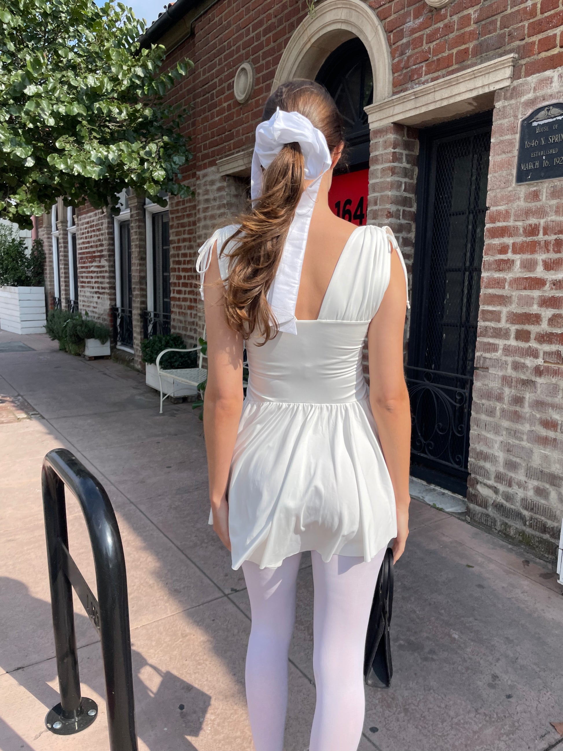 girl in white dress and white tights