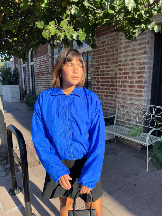 girl in blue jacket and black mini skirt