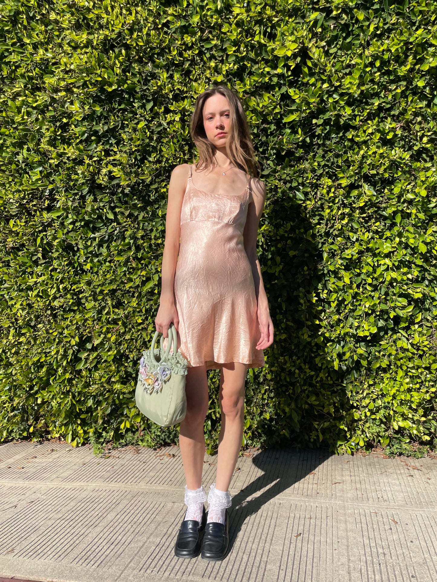 girl in silky pink dress