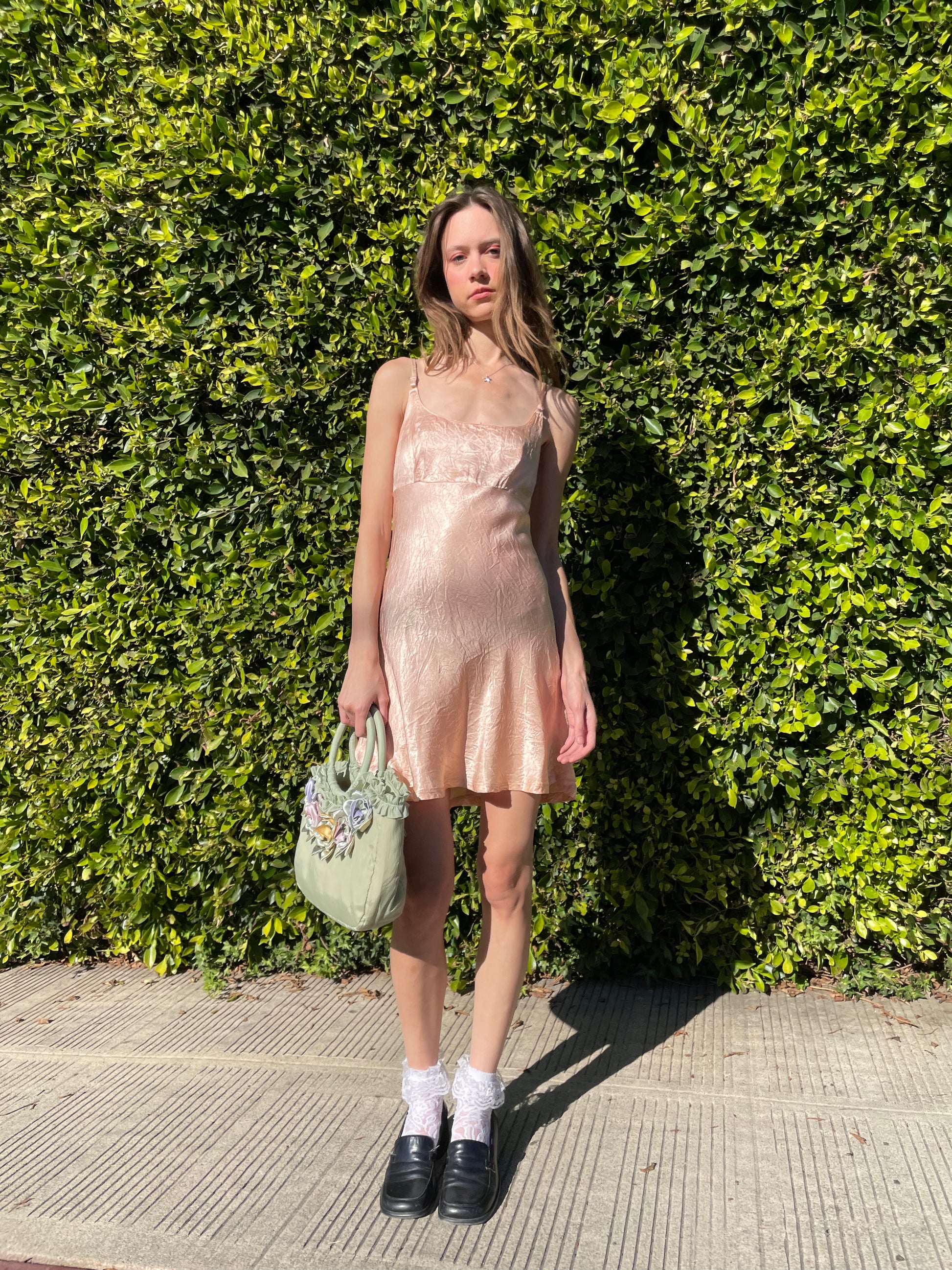 girl in silky pink dress