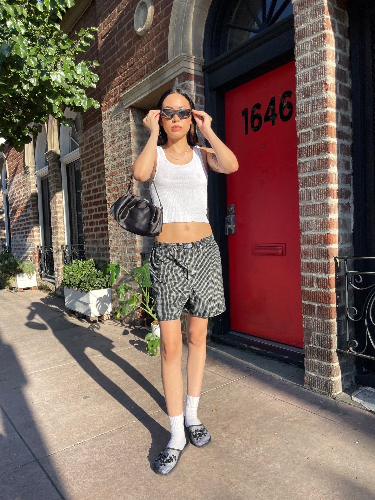 girl in white tank and boxer shorts