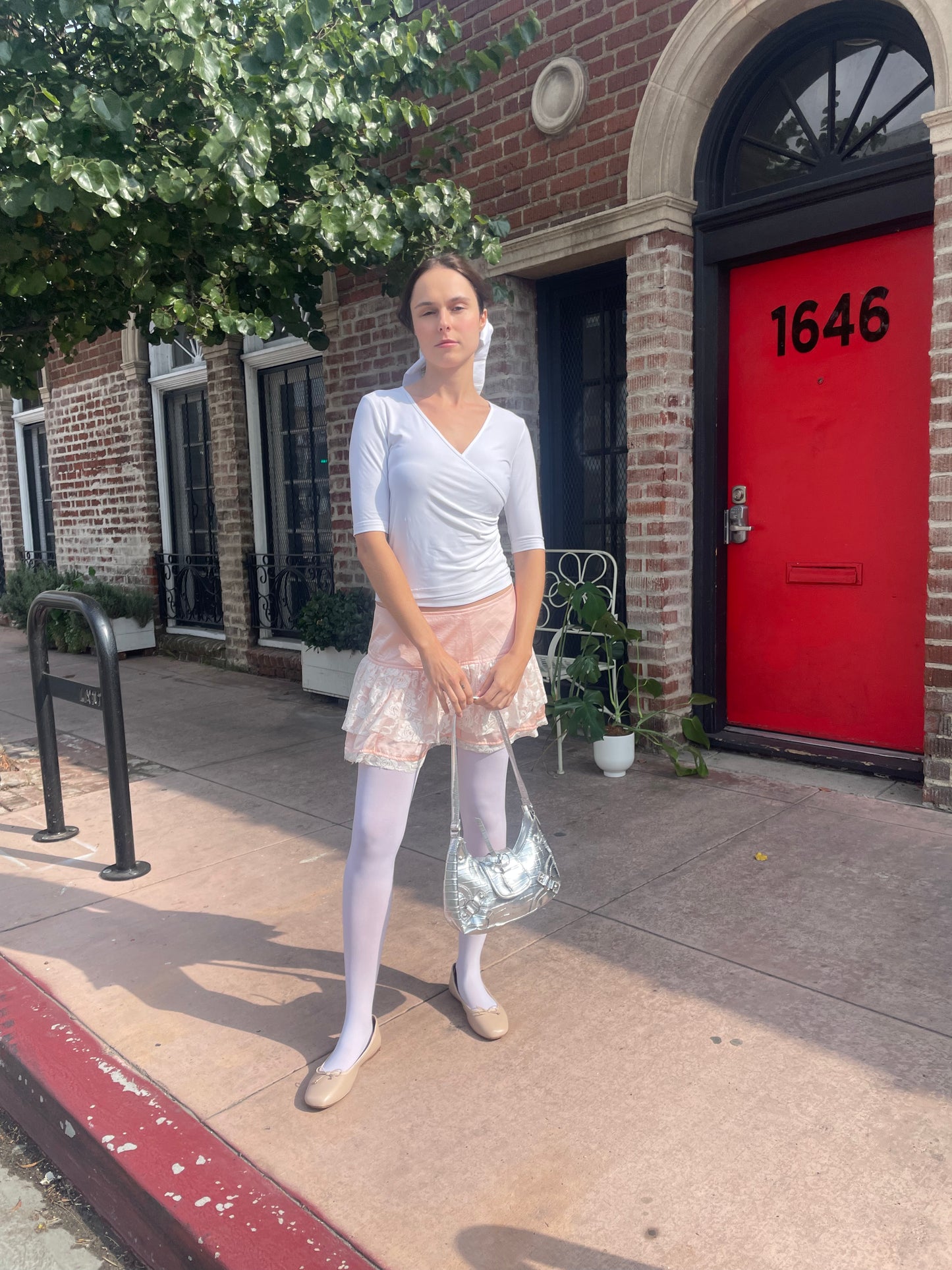 girl in white top and pink skirt