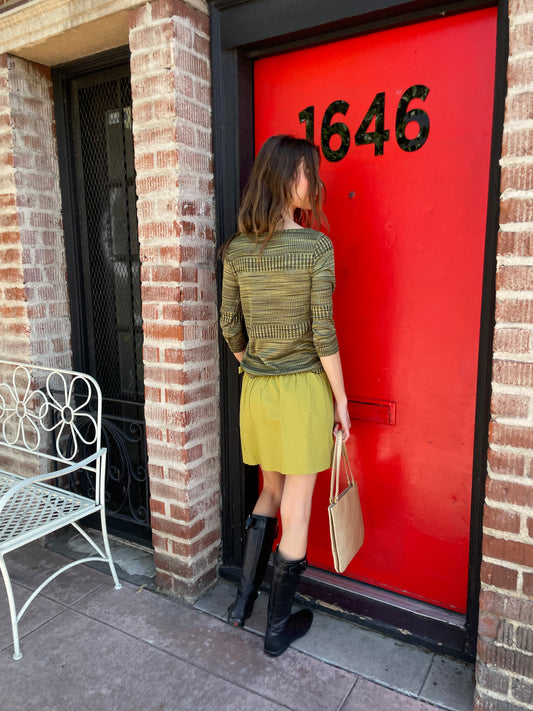girl in green long sleeve and green skirt