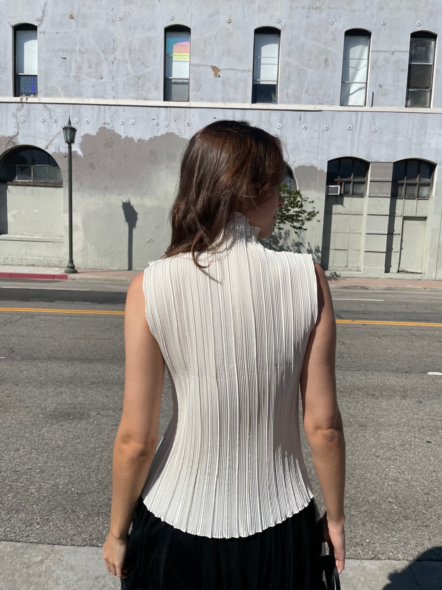 girl in white high neck top