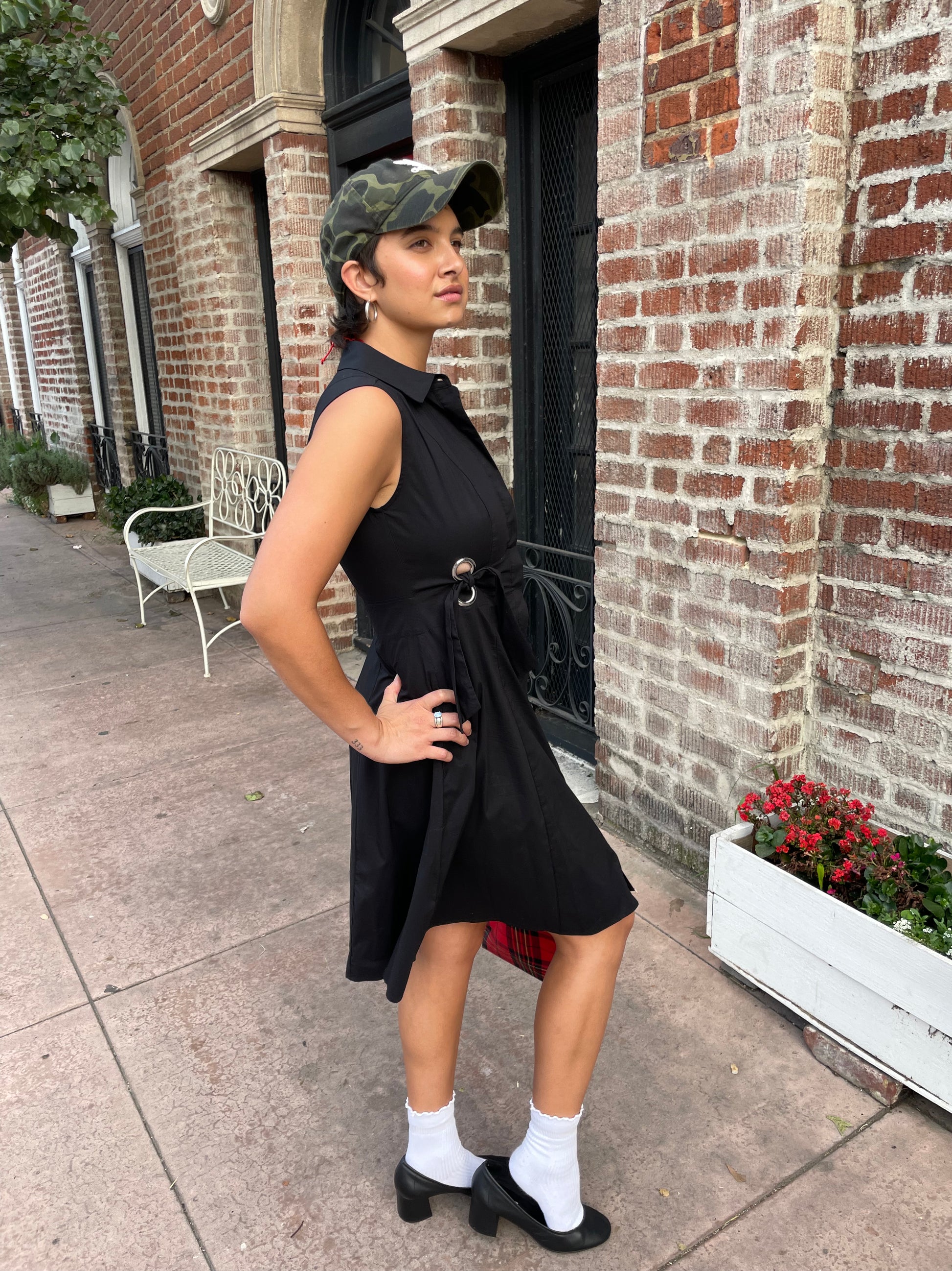 girl in black sleeveless dress