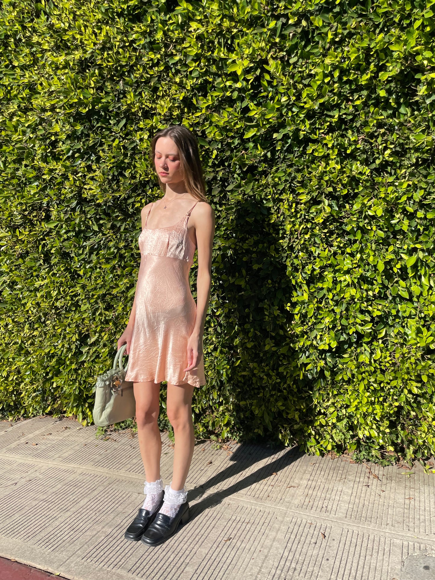 girl in silky pink dress