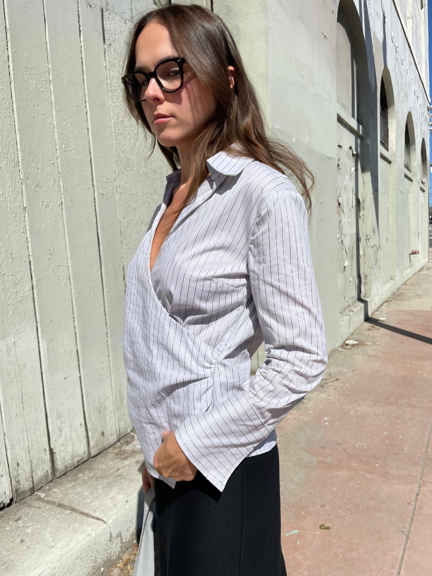 girl in striped wrapped button down top