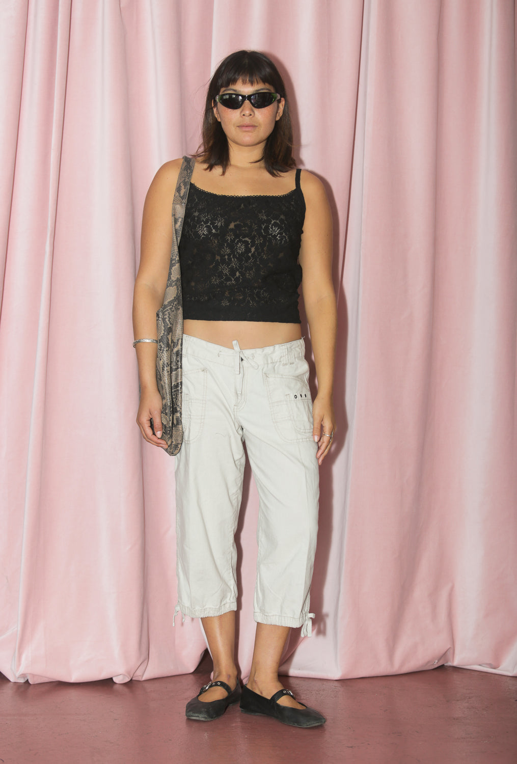 girl in khaki capri and lace tank