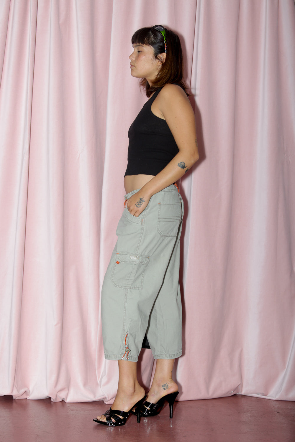 girl in green capri and black tank