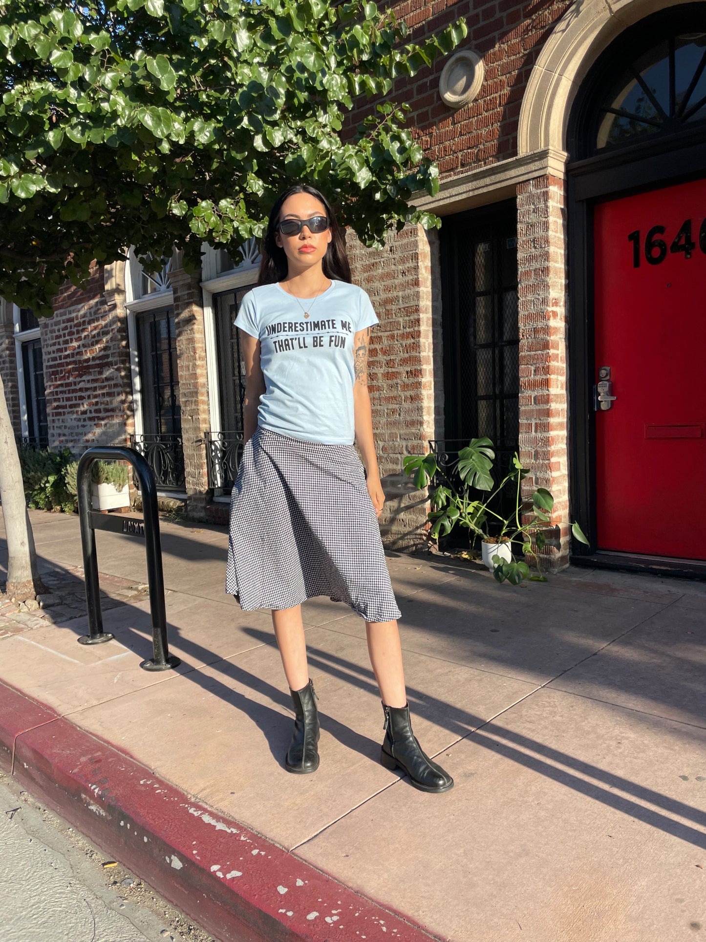 girl in graphic t-shirt and gingham skirt