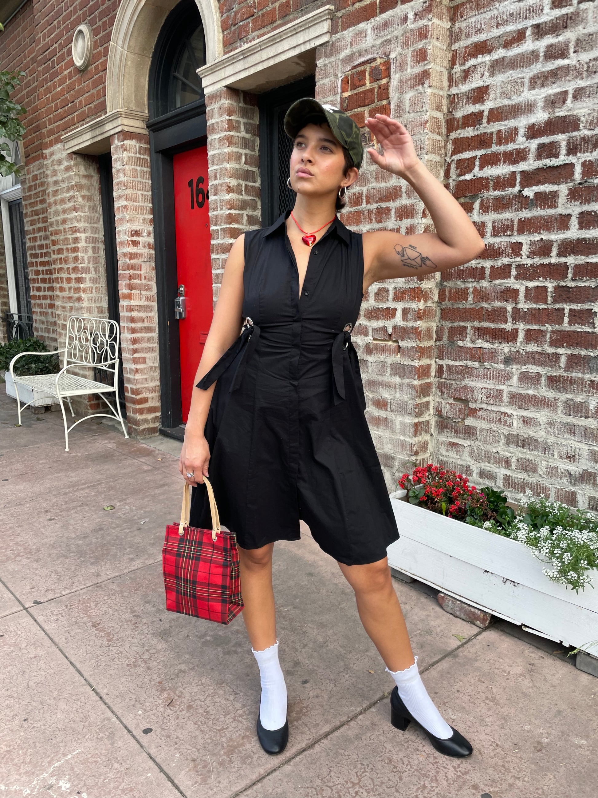 girl in black sleeveless dress