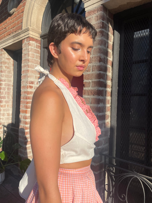 girl in cream and pink halter