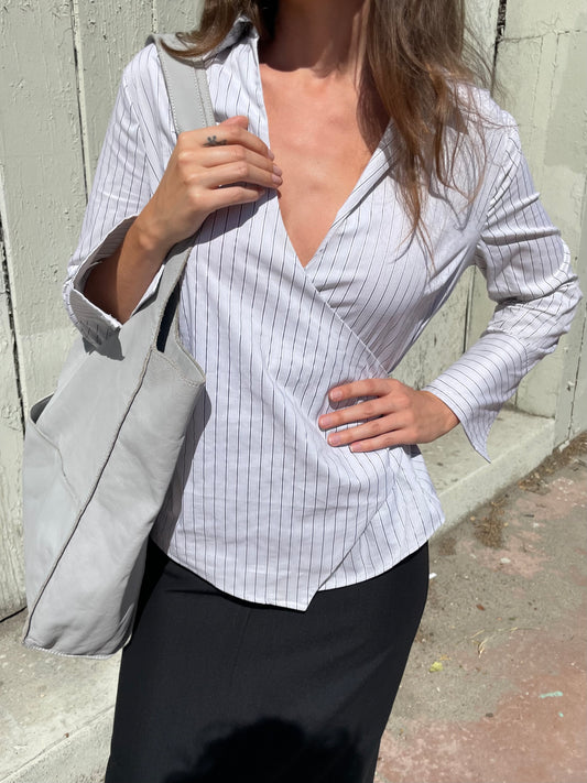 girl in striped wrapped button down top