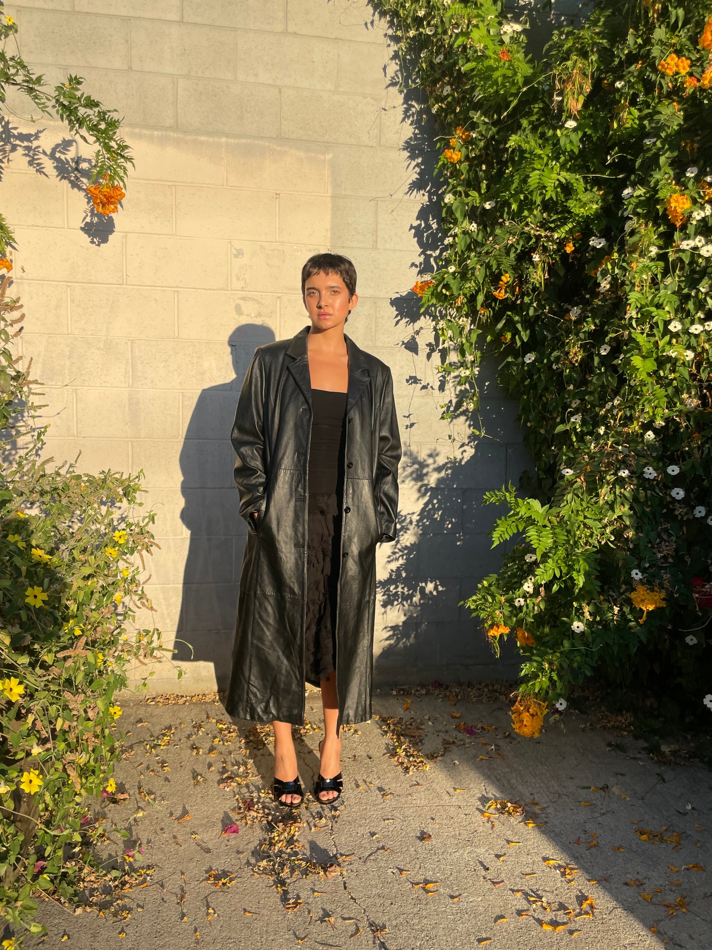 girl wearing leather long jacket