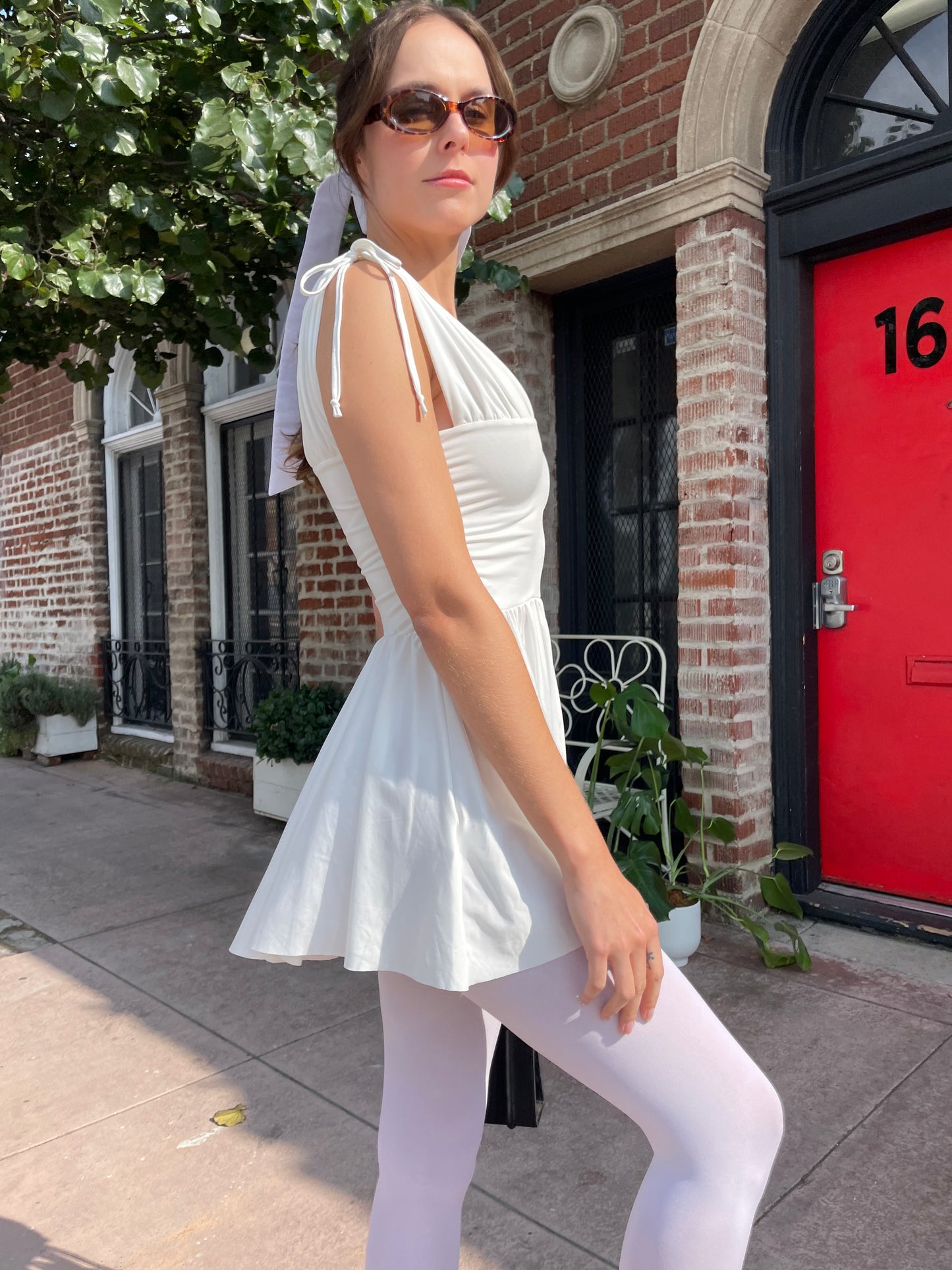 girl in white dress and white tights