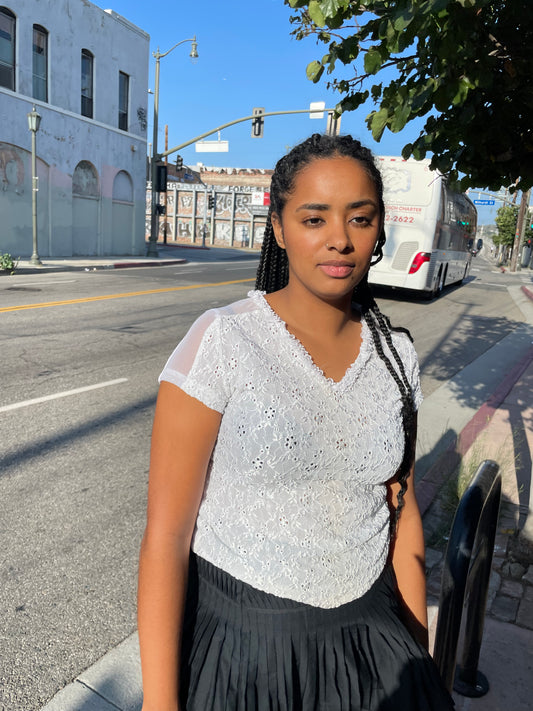 girl wearing White Ruffle V Neck Top