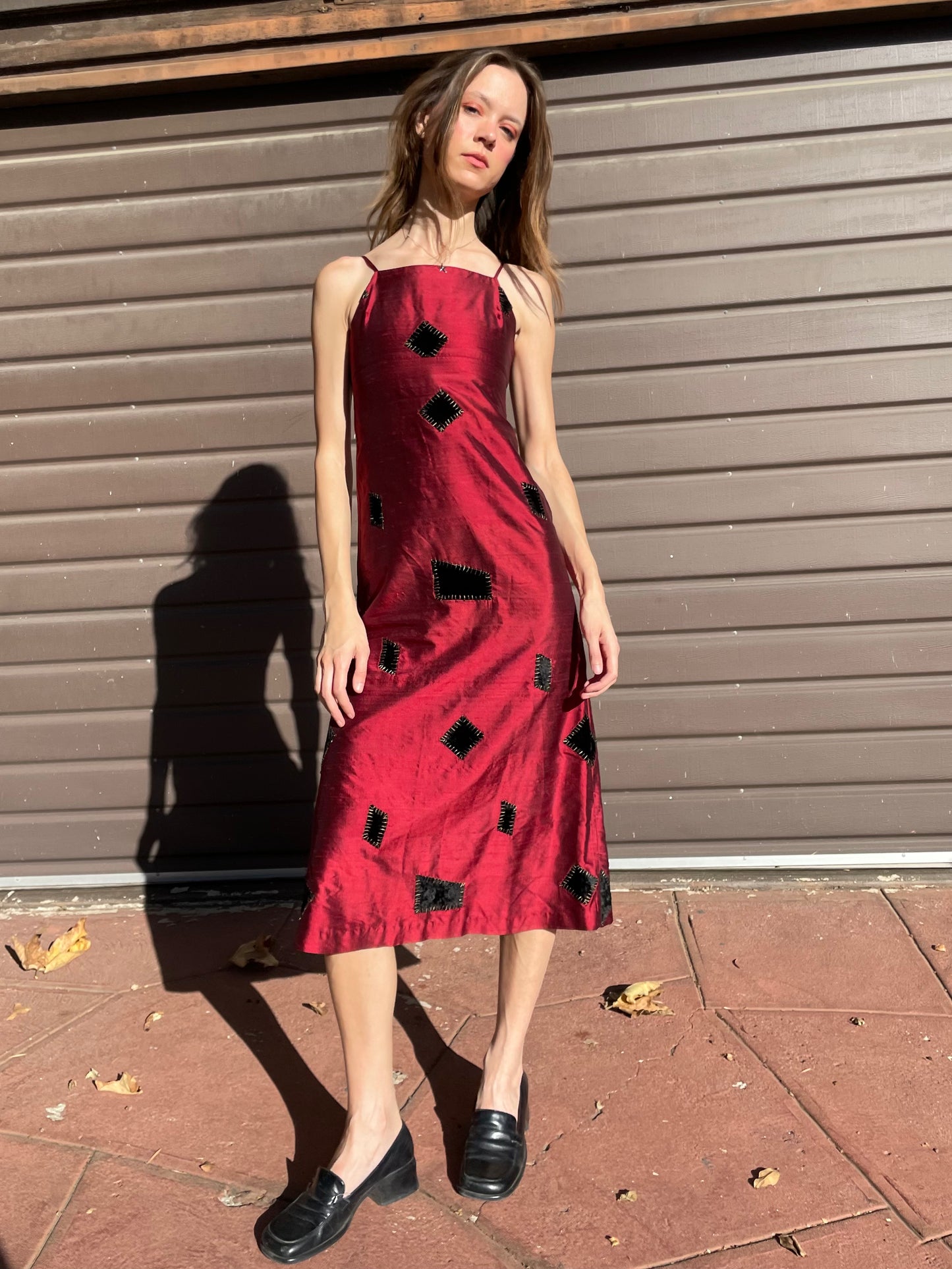 girl in red patchwork dress