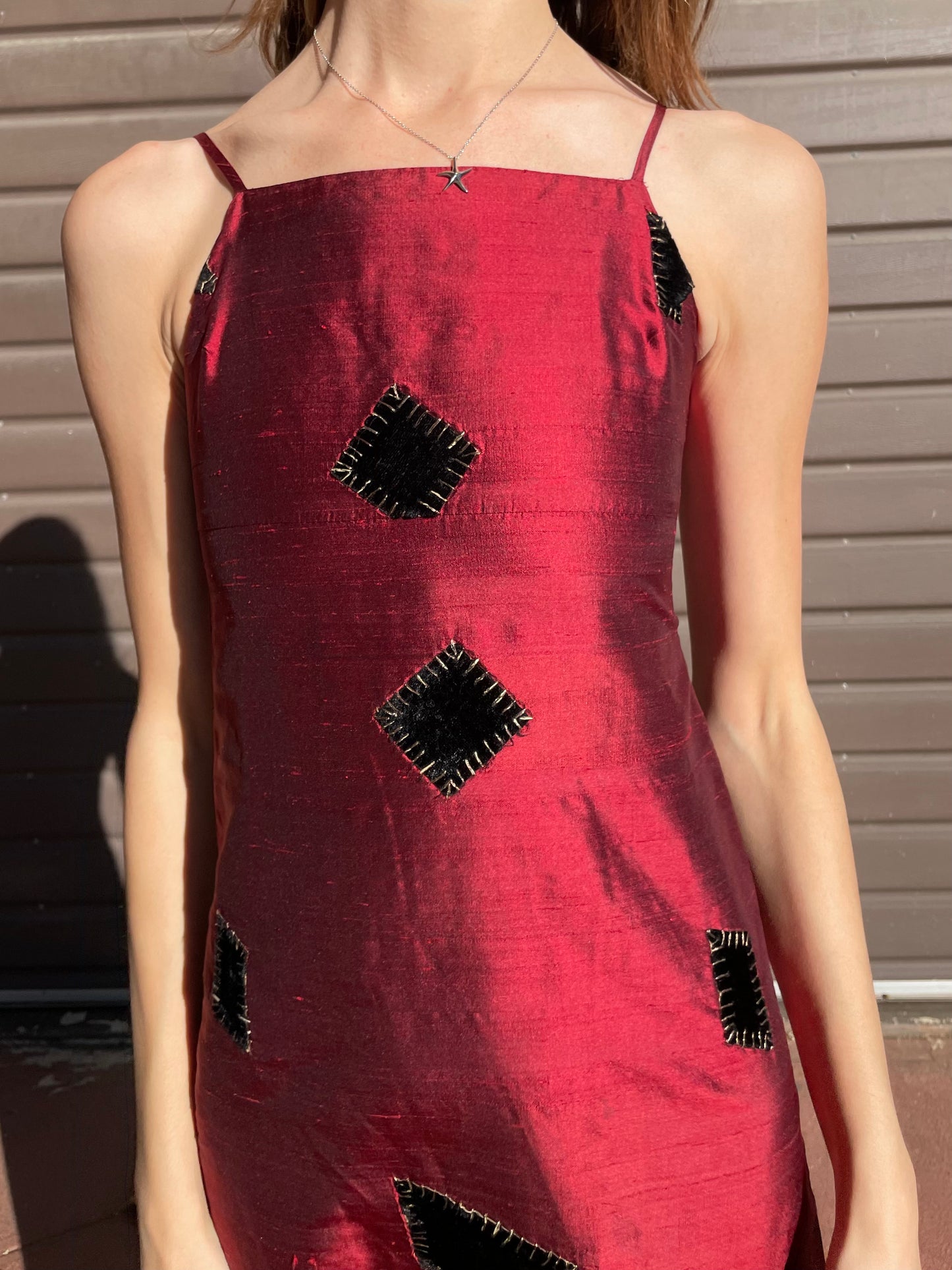 girl in red patchwork dress