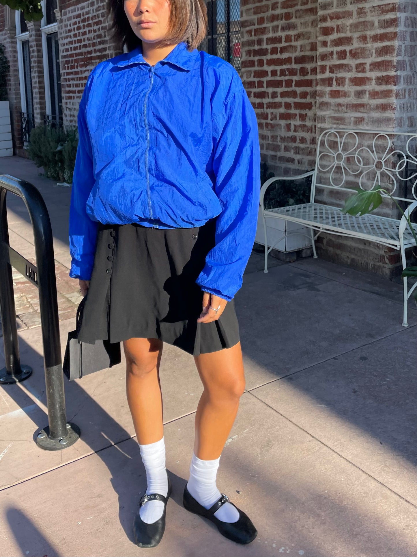 girl in black button down skirt