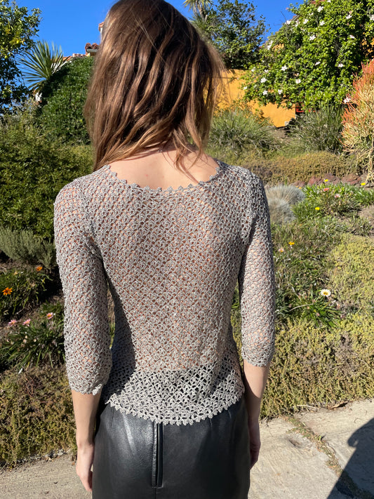 girl in silver knitted long sleeve