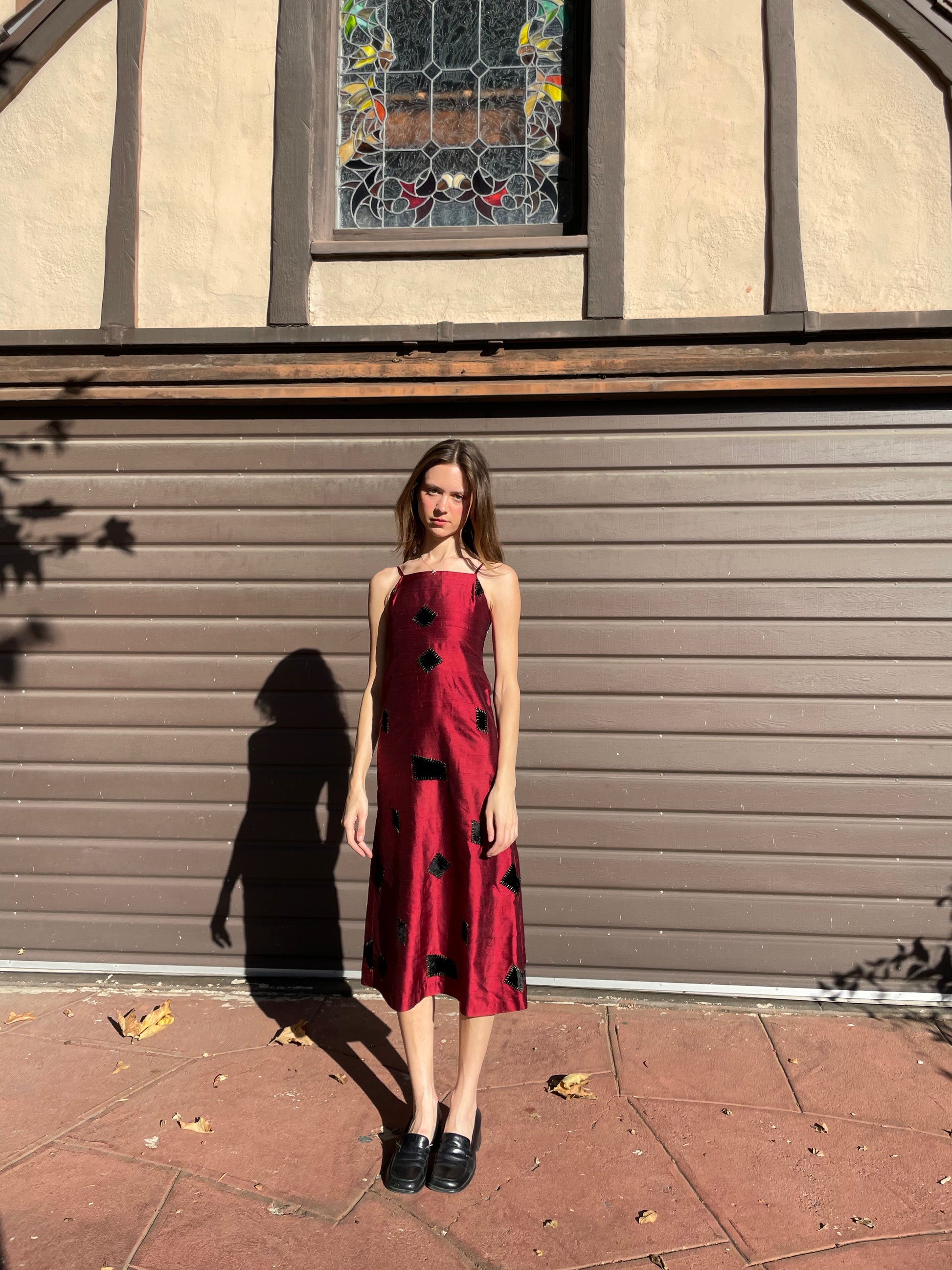 girl in red patchwork dress