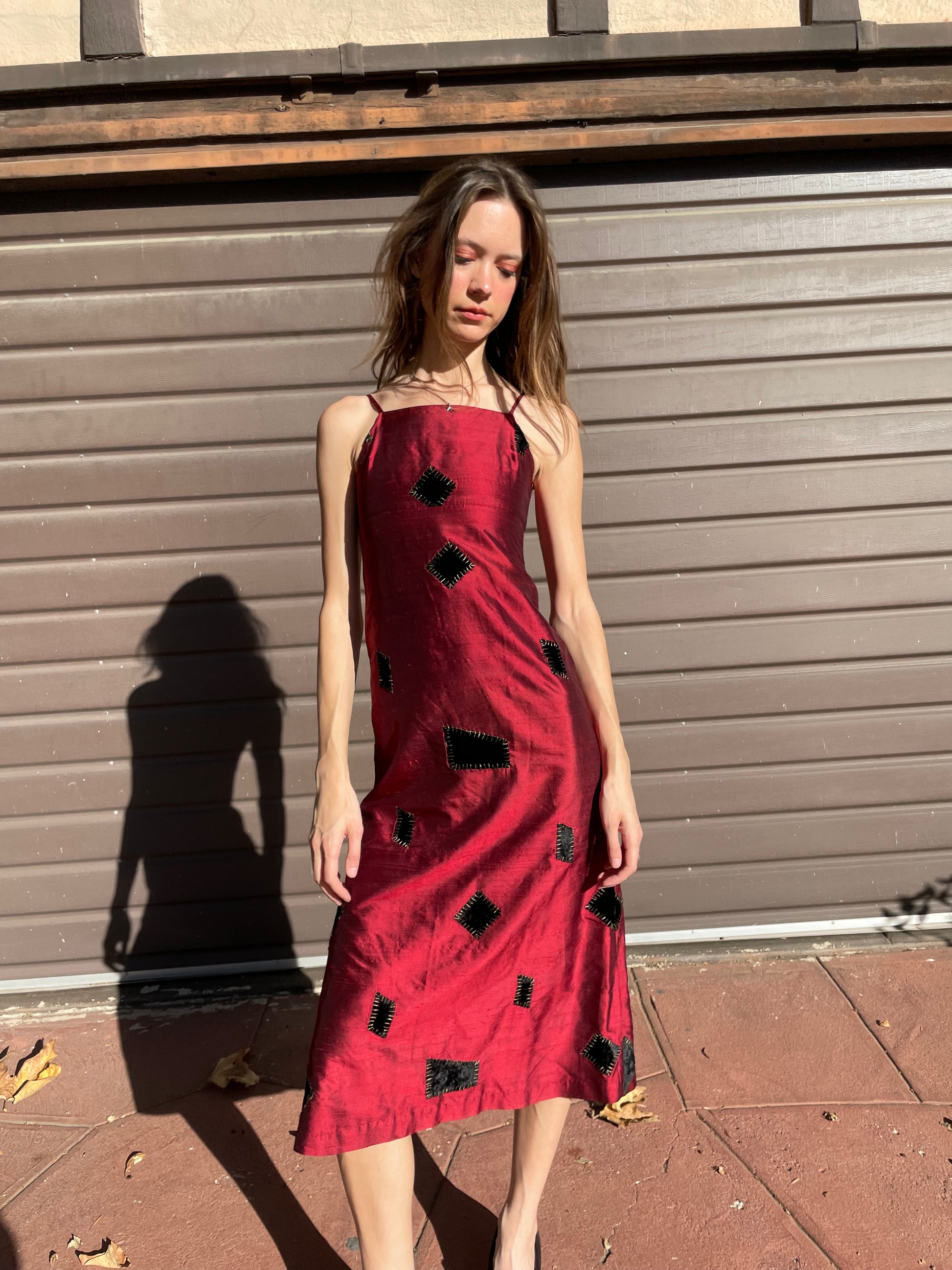 girl in red patchwork dress