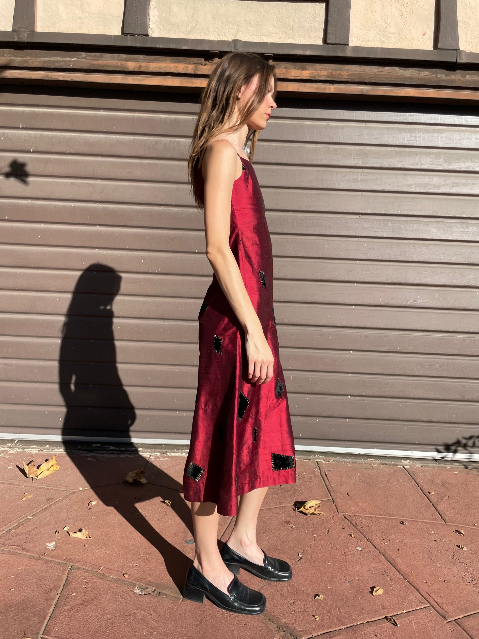 girl in red patchwork dress