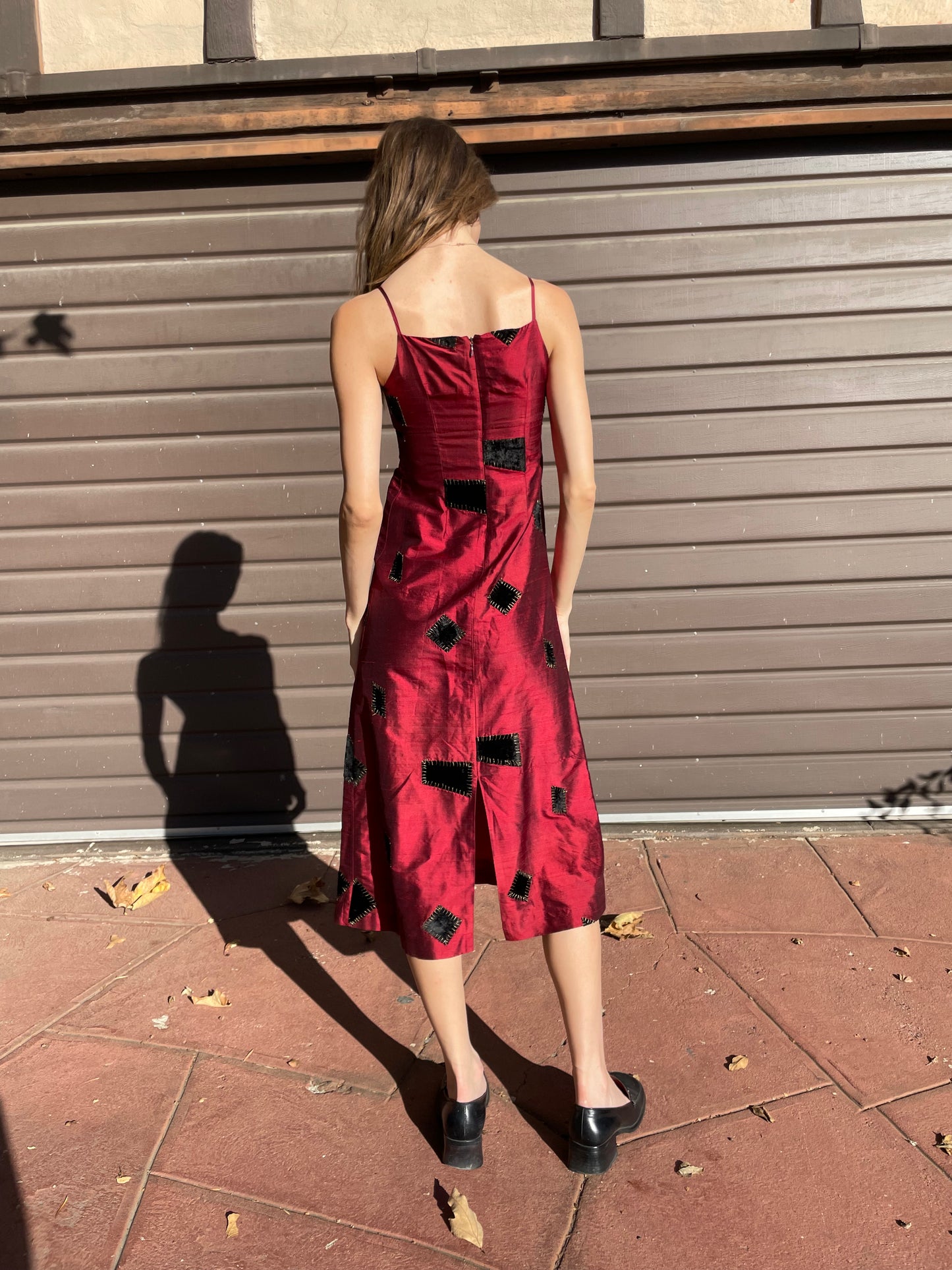 girl in red patchwork dress