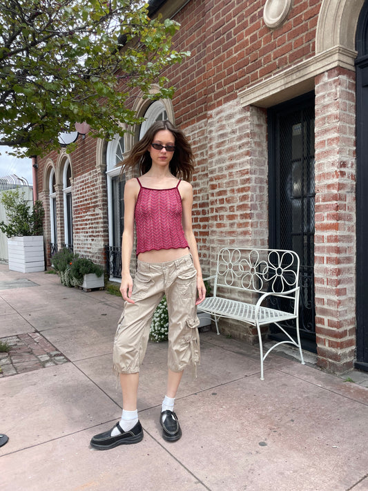 girl wearing red shirt and tan cargo pants