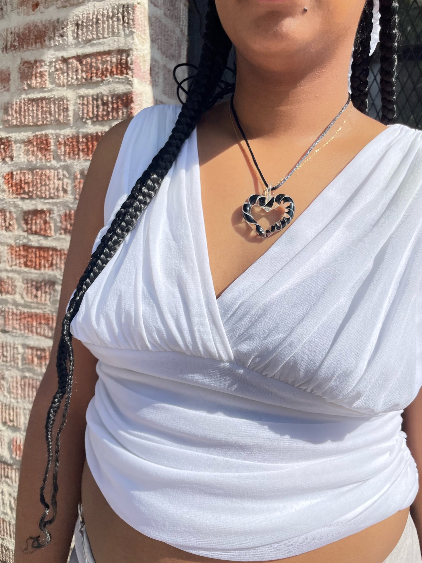 girl in white tank and tan skirt