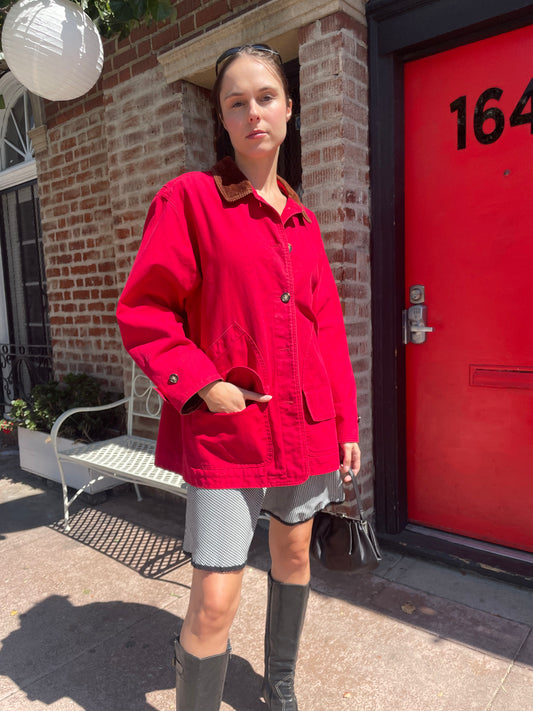 girl in red jacket and black and white skirt