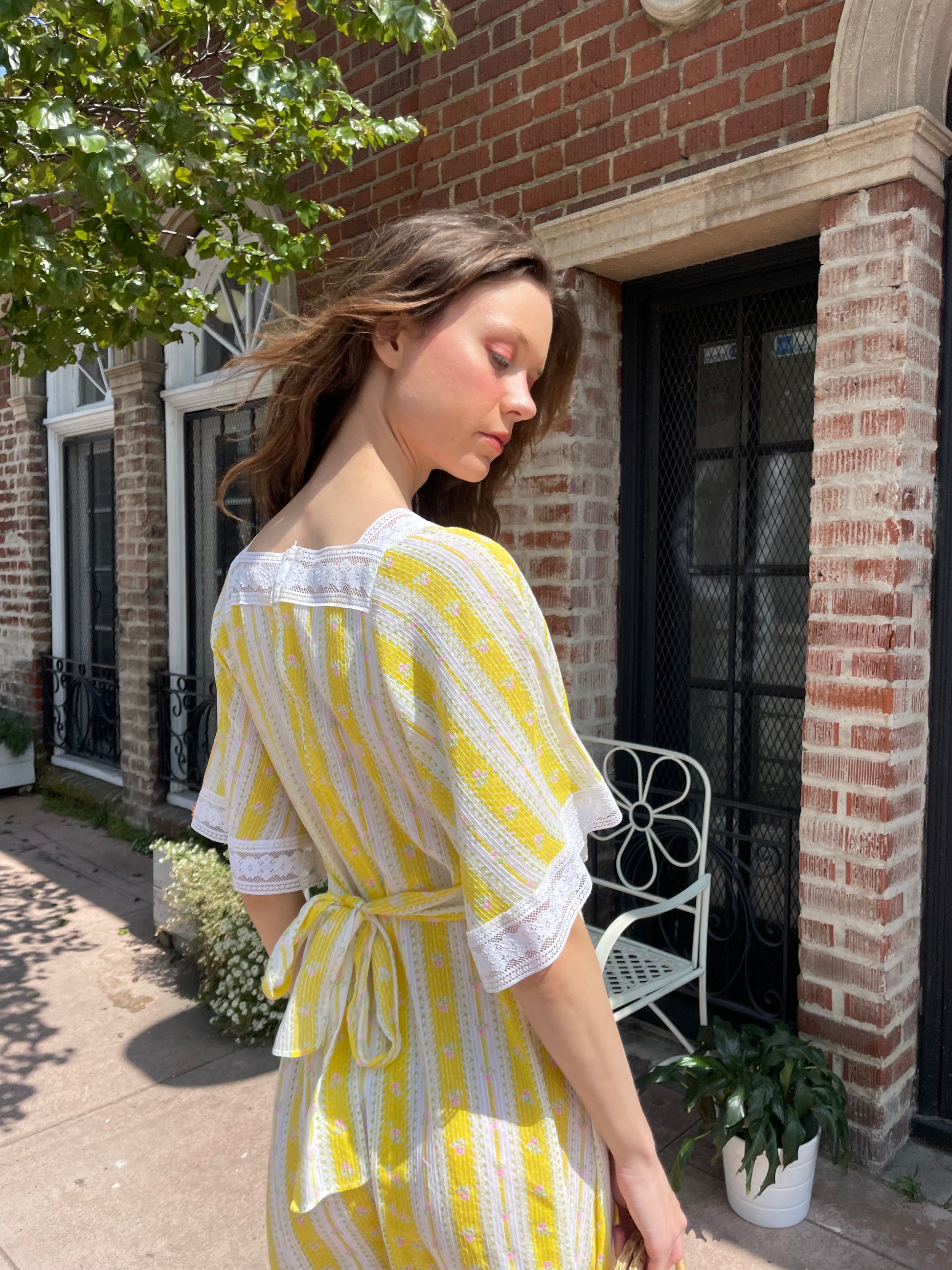 girl wearing long yellow and lace dress