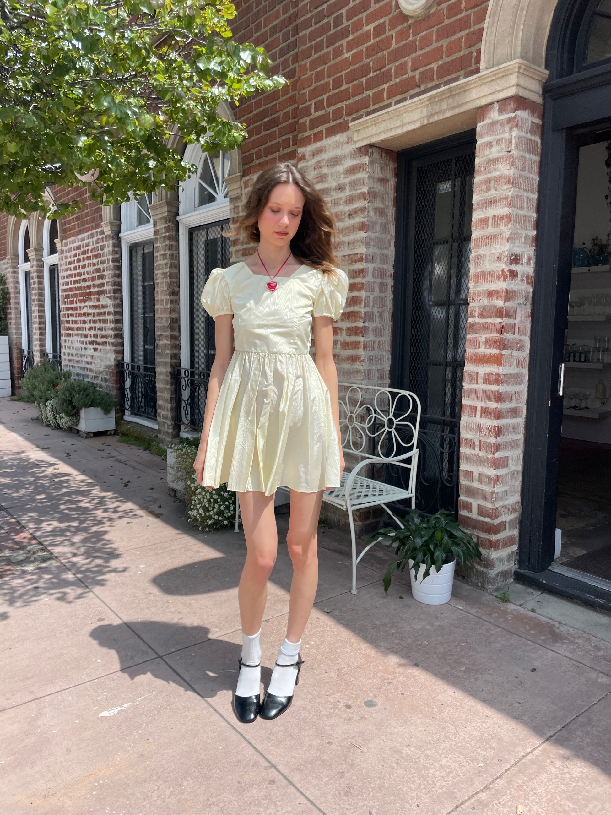 girl wearing yellow short dress