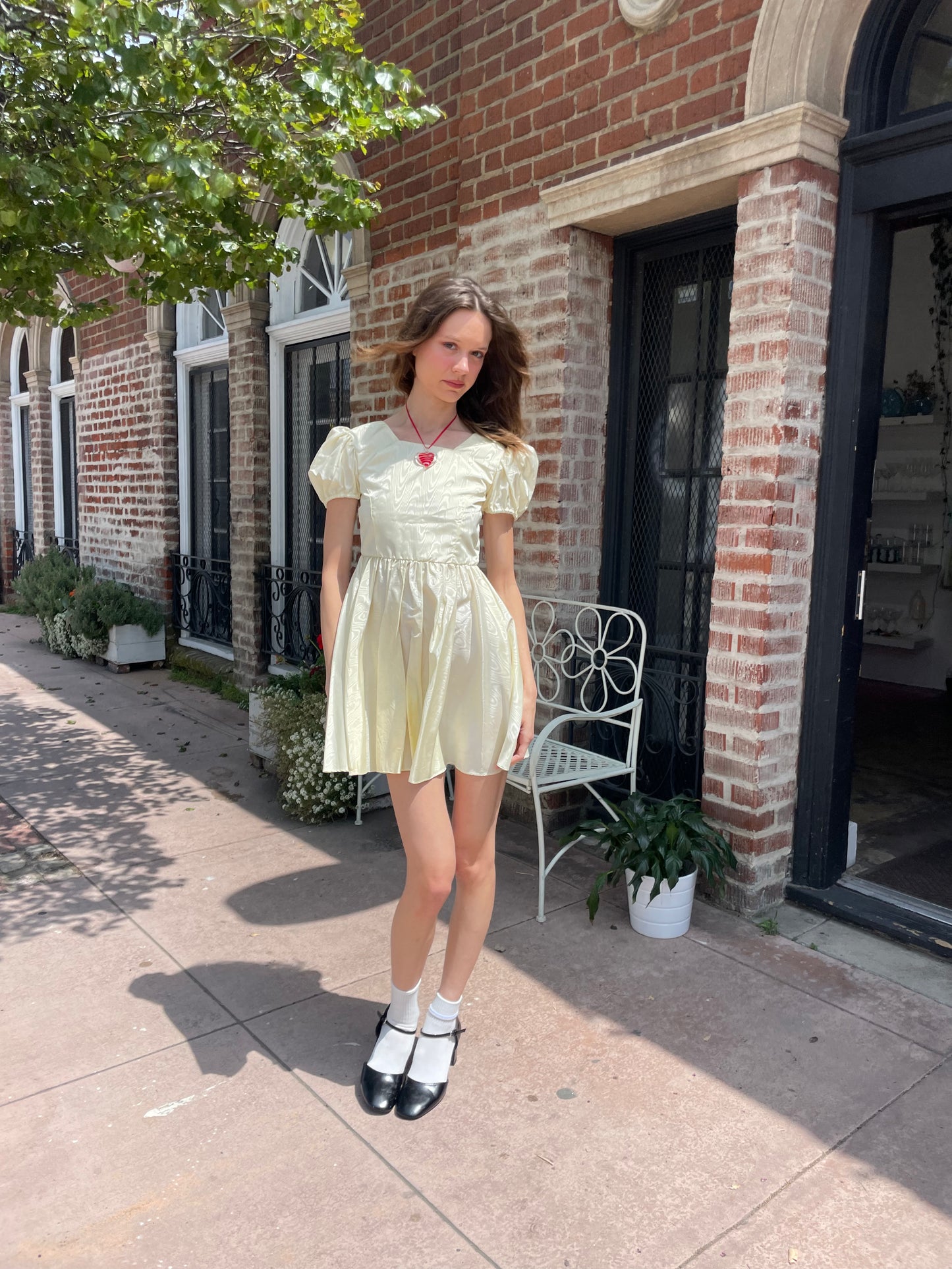 girl wearing yellow short dress